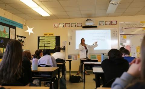 pharmacy student presenting on substance use stigma to seventh grade class